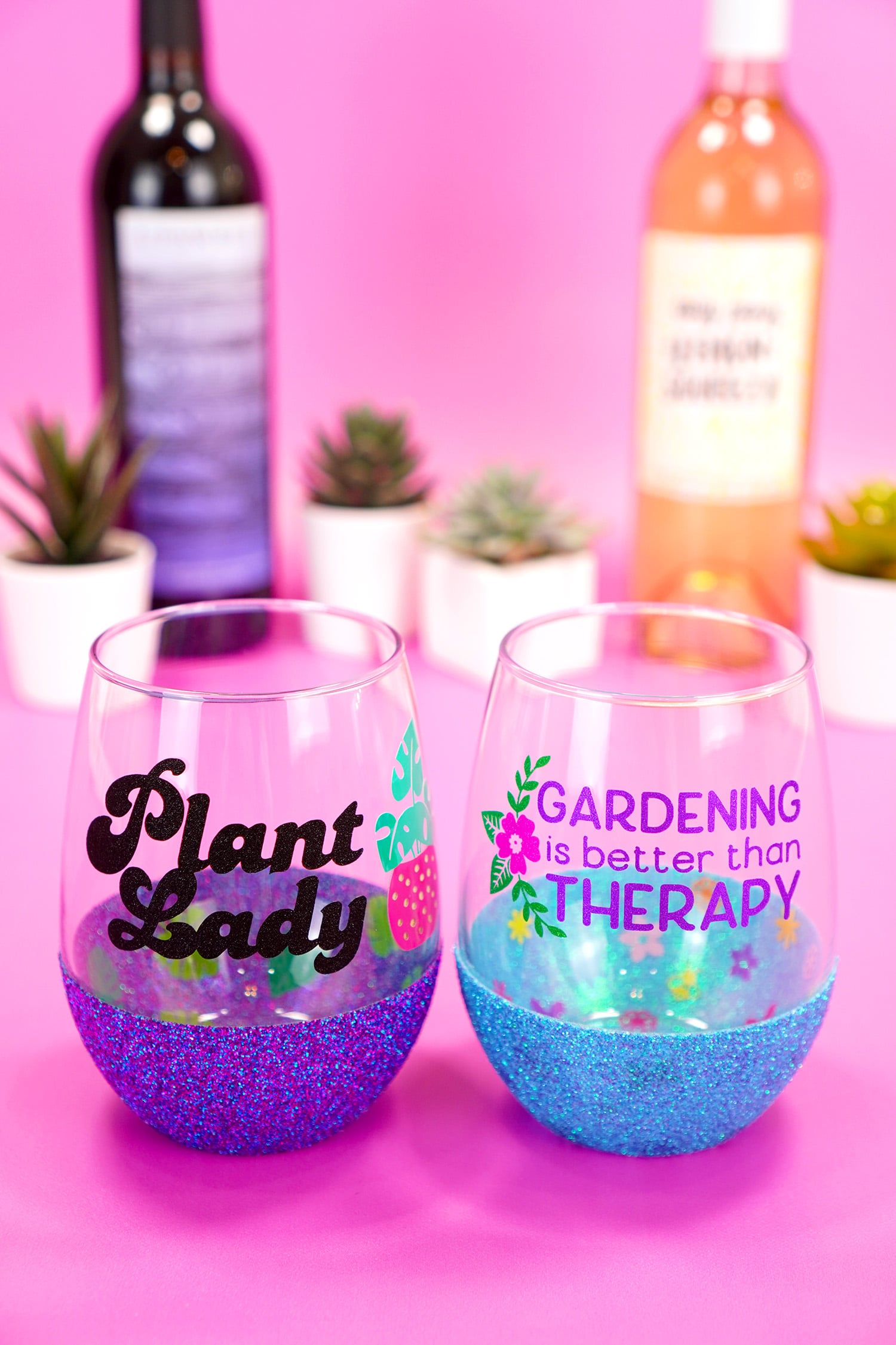 "Plant Lady" stemless wine glass with purple glitter base and "Gardening is Better Than Therapy" wine glass with blue glitter base