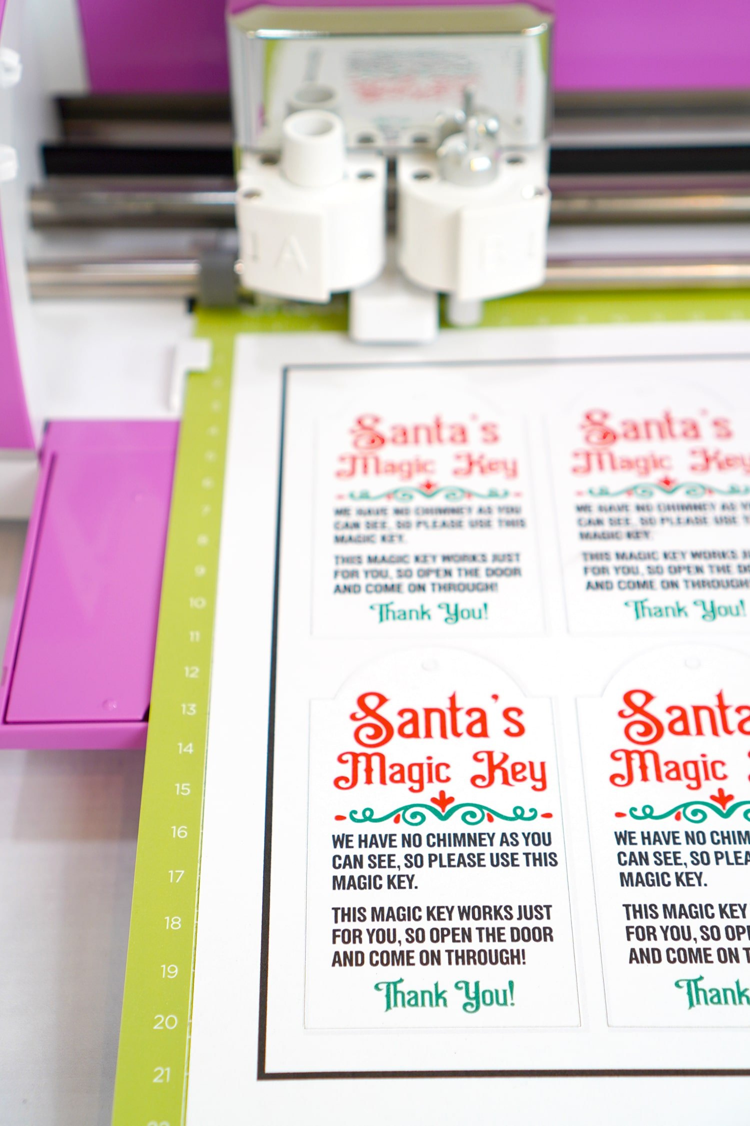 Close up of Santa's Magic Key printables on green Cricut mat