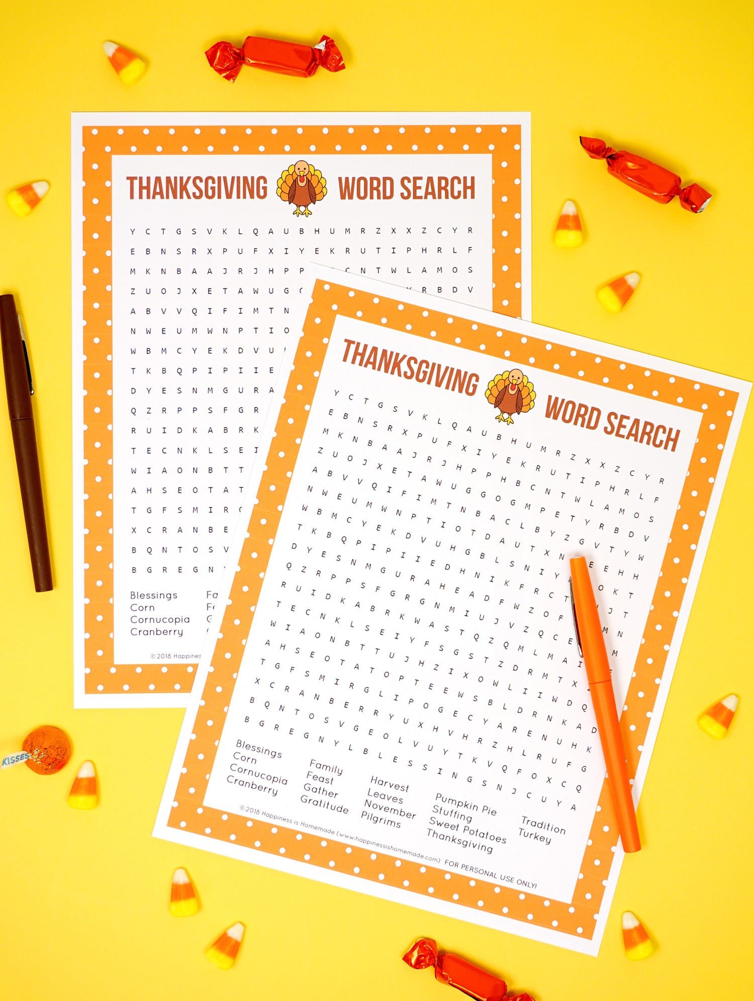 Two Printable Thanksgiving Word Search puzzle games on yellow background with brown & orange pens and candy