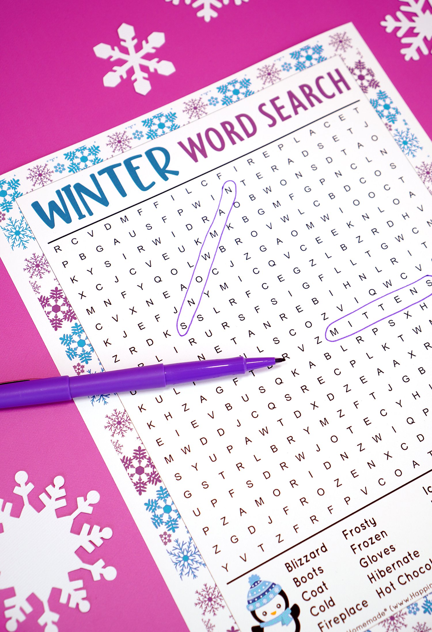 Close up of Winter word search printable puzzle on purple background with snowflakes and purple pen