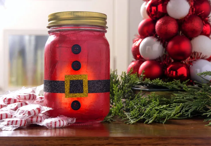 santa mason jar luminary on table with decor