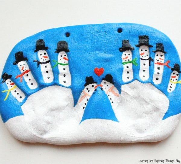 snowmen made from childs handprint pressed into salt dough as an ornament