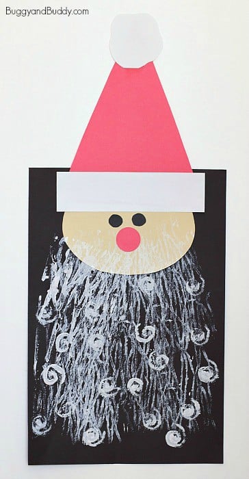 santa craft with printed beard on black paper