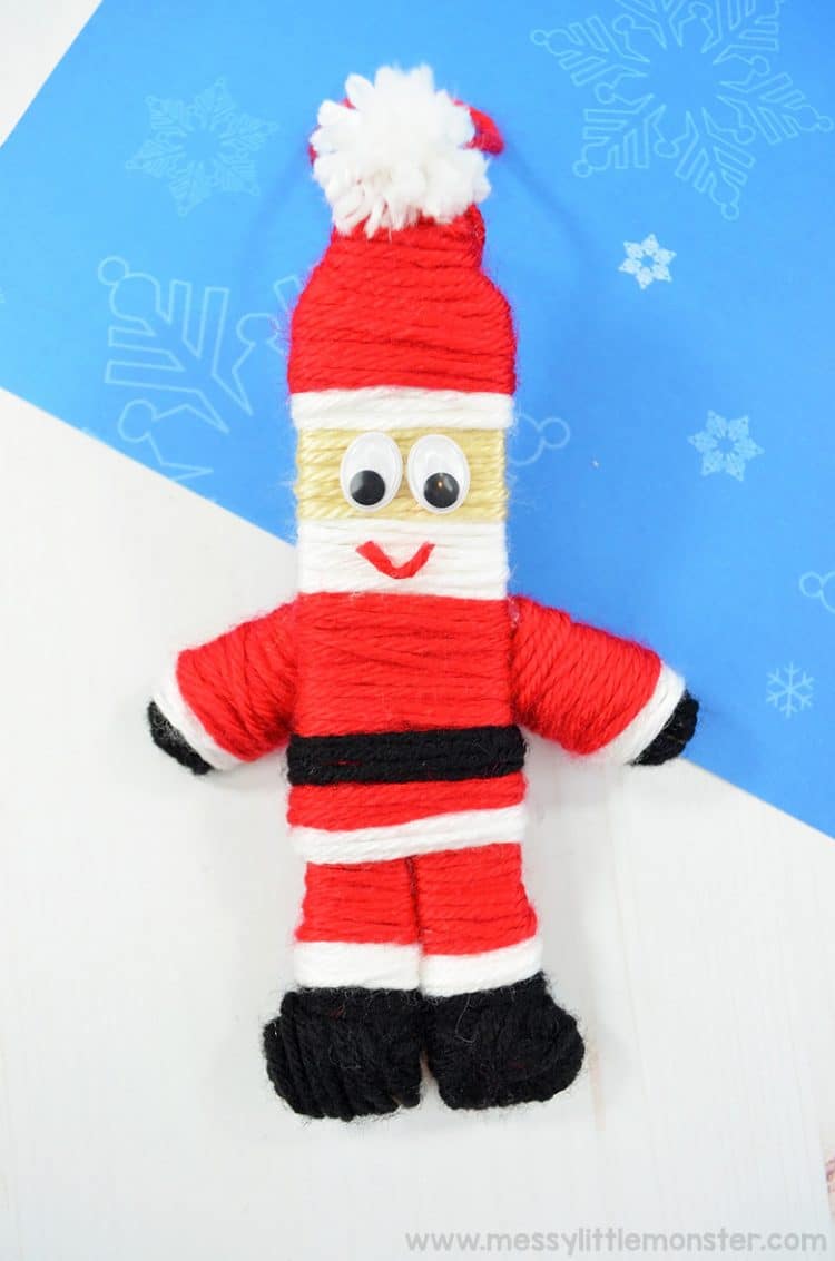 santa made from yarn ornament with snowflakes