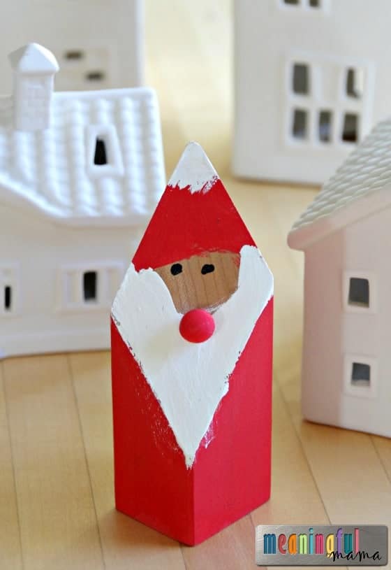 santa claus made from wood block in christmas village