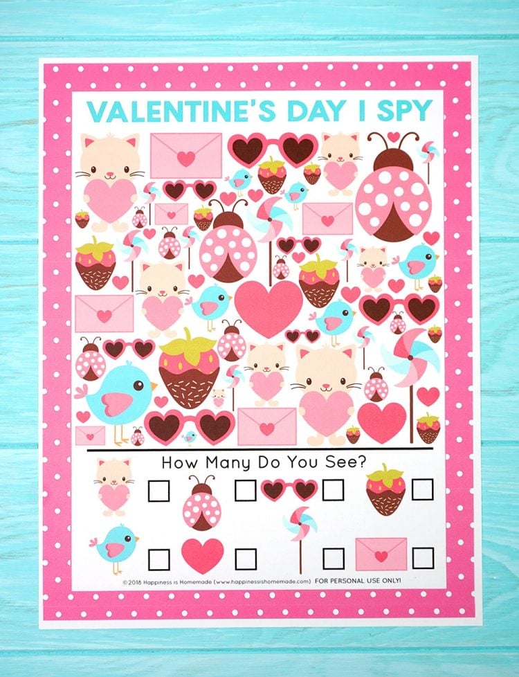 Valentine's Day I Spy Game on blue wood background