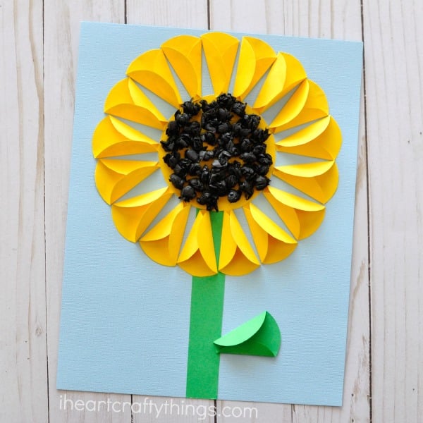 yellow paper sunflower on blue background