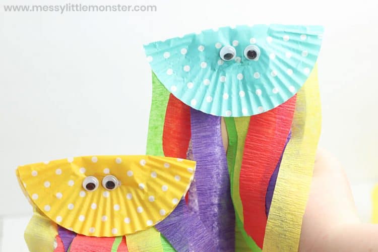 two cute rainbow streamer jelly fishes made from cupcake liners