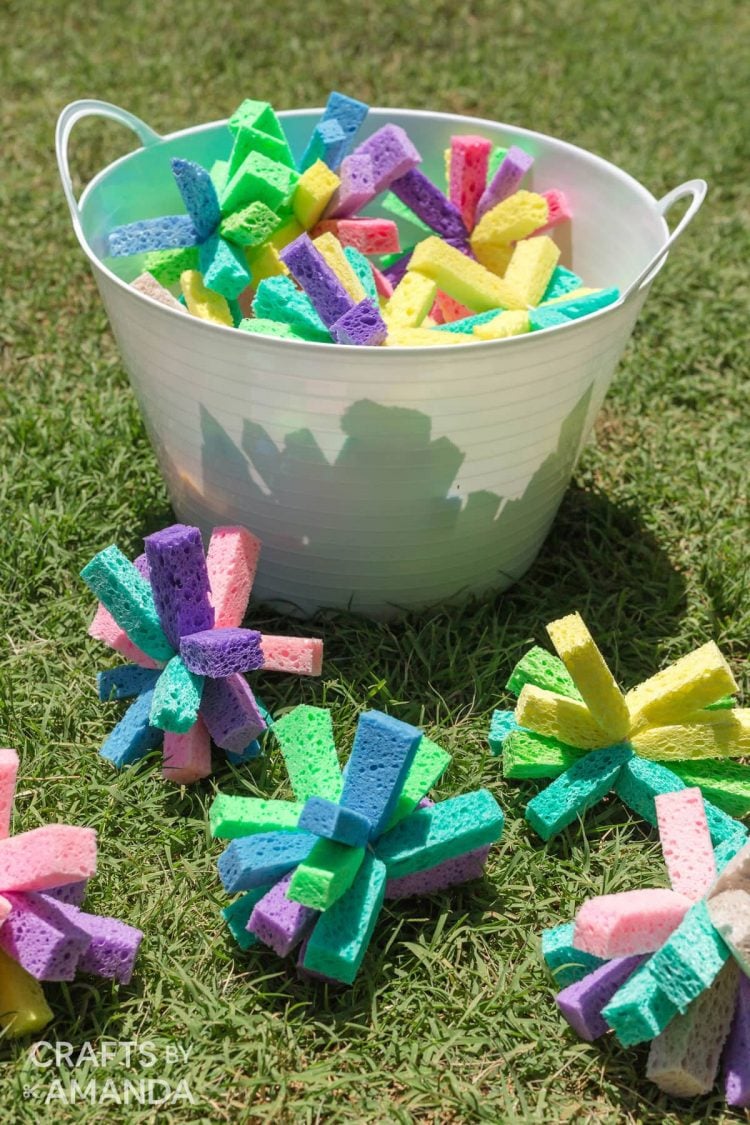 sponge water bombs in bucket outside