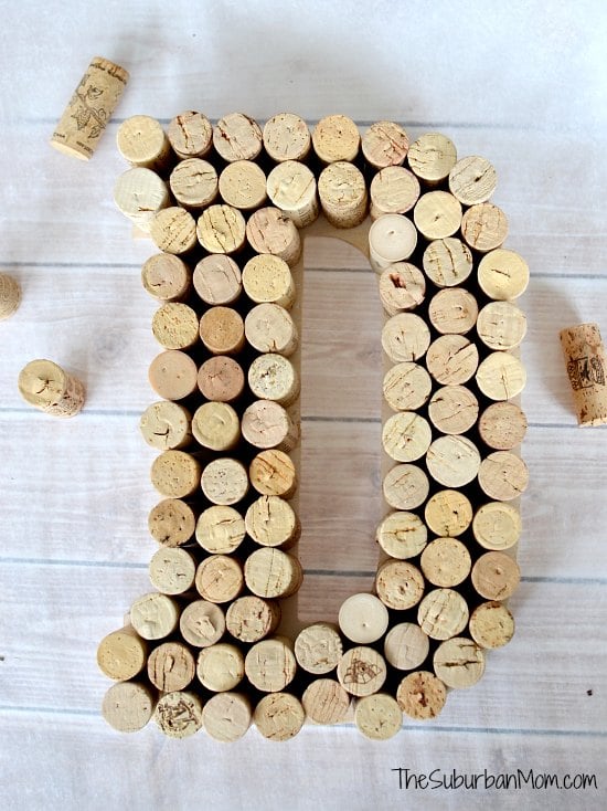 large letter "D" made from wine corks