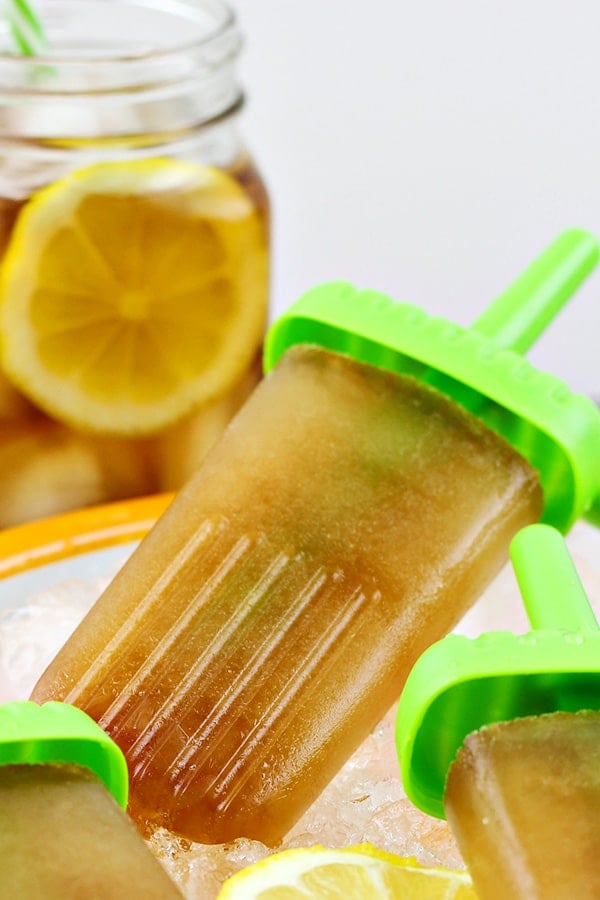 sweet tea vodka ice pops with iced tea in background