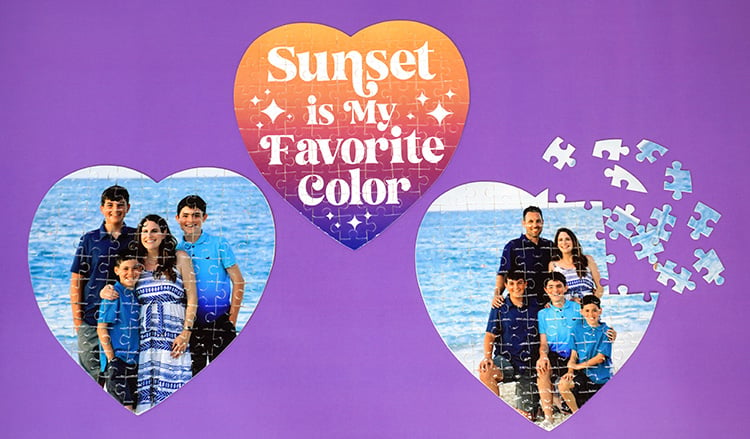 Three heart-shaped custom photo puzzles on a purple background