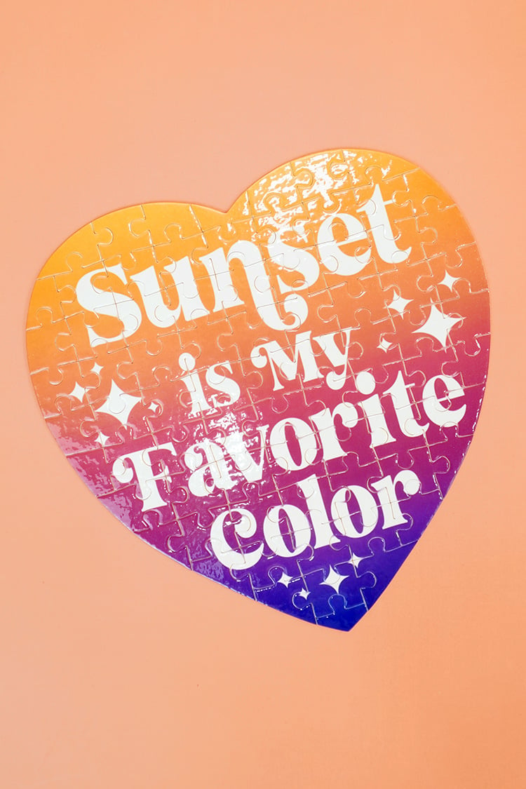 Colorful "Sunset is My Favorite Color" jigsaw puzzle on orange background