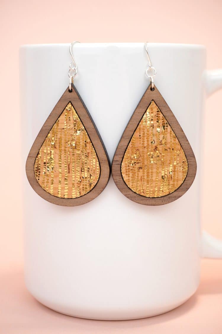 teardrop laser cut wood earrings with metallic gold dotted cork inlay