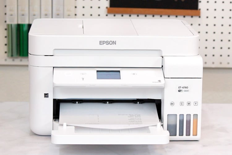 Epson EcoTank printer with printed paper in tray