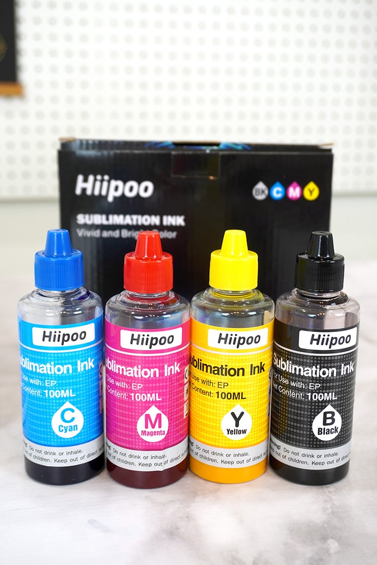 4 bottles of Hiipoo sublimation ink in cyan, magenta, yellow, and black