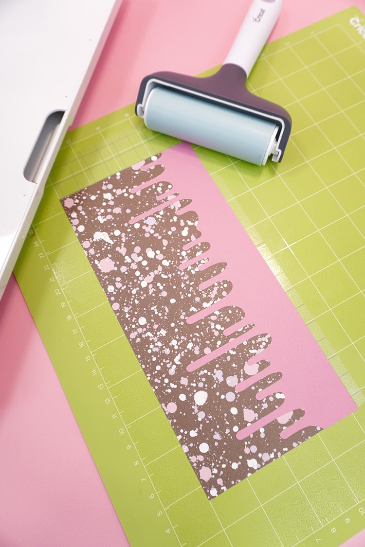 Two colors of Infusible Ink in a "Drippy" design on a Cricut cutting mat
