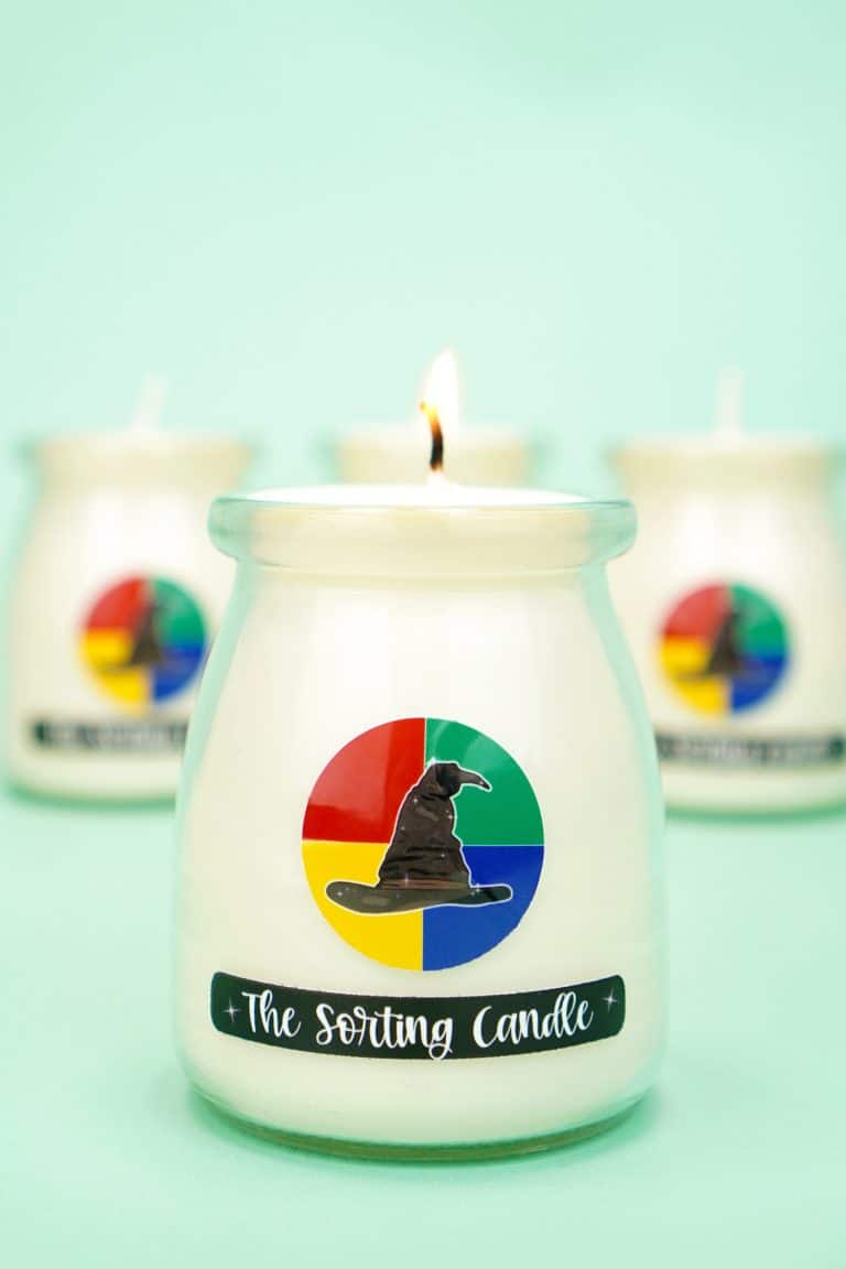 White candle with "The Sorting Candle" label on mint green background