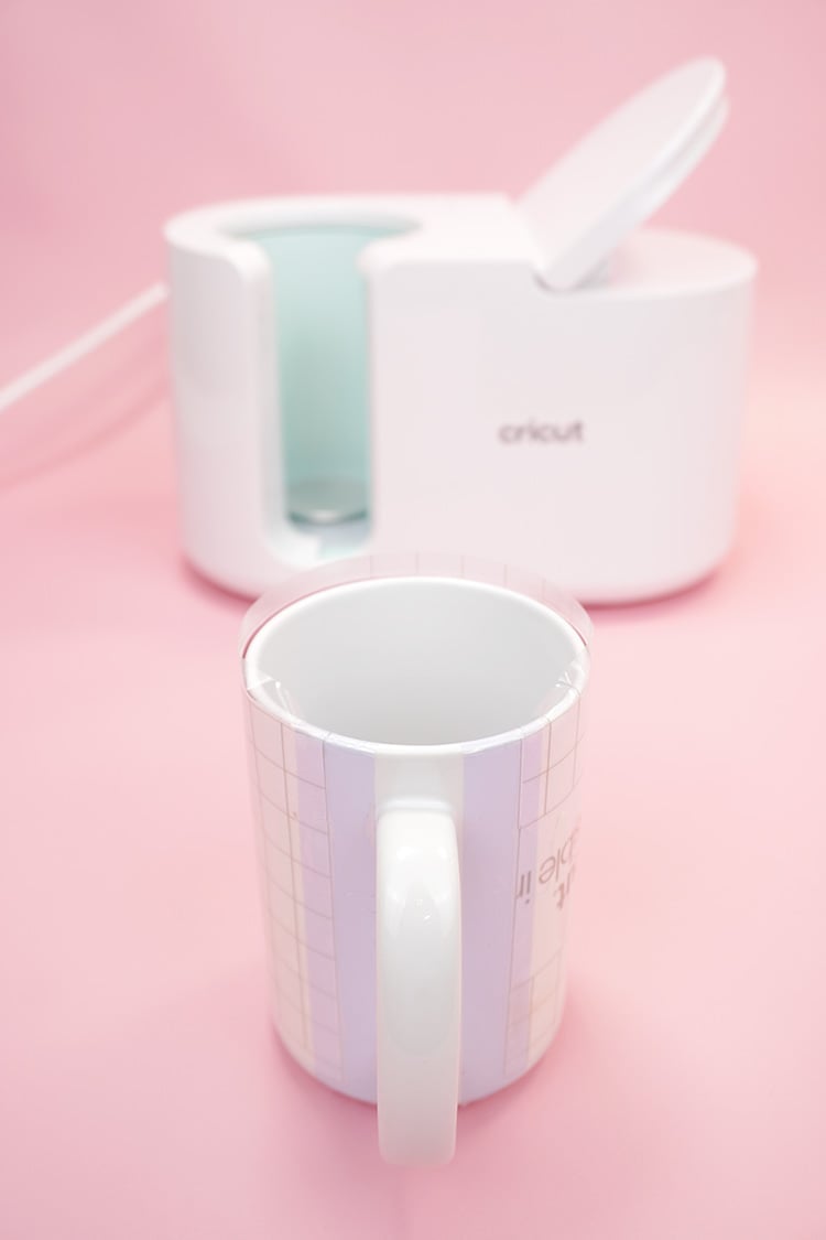 Wrapping a white sublimation mug with Infusible Ink and heat tape