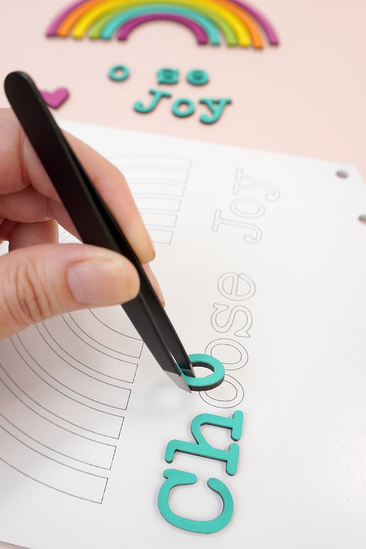 tweezers placing letters on macrame kit