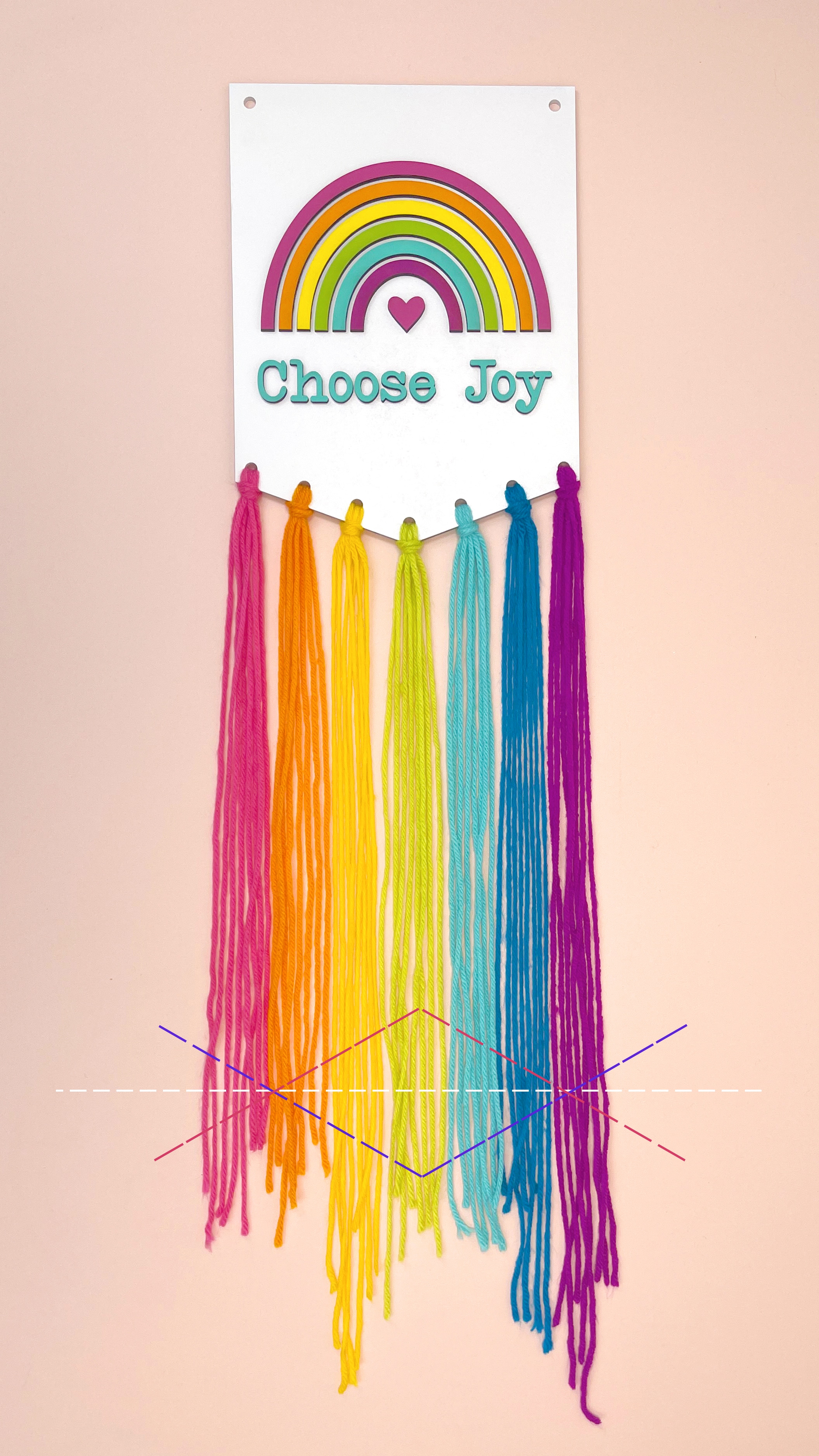 completed choose joy sign with cut marks on strings