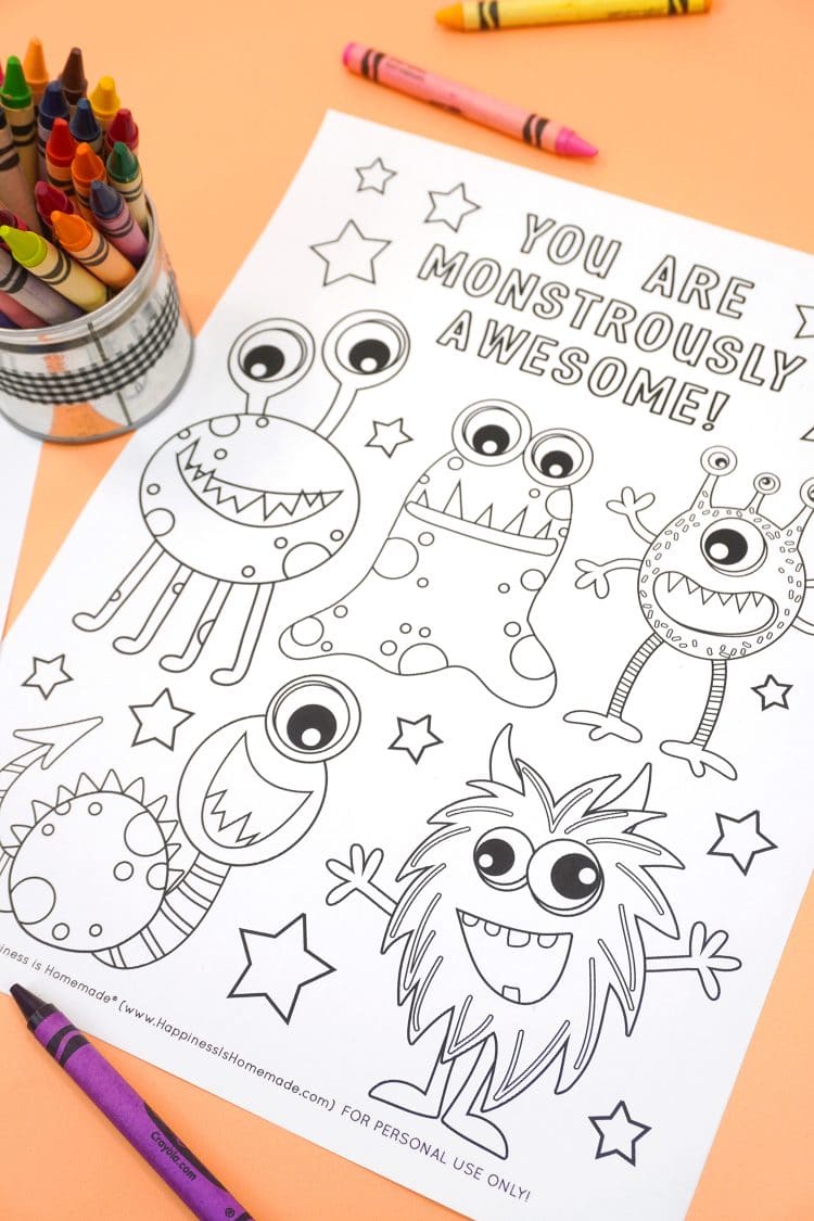 "You Are Monstrously Awesome" monster coloring page on orange background with crayons