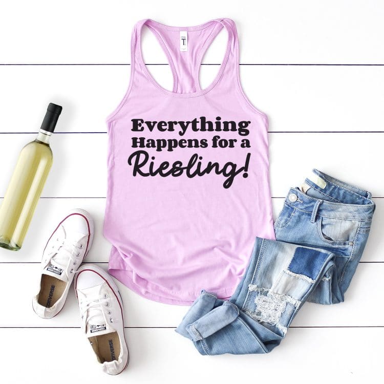 Lavender tank top with "Everything Happens for a Riesling" design styled with outfit and bottle of wine