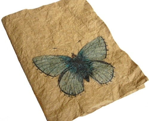 butterfly stamped onto journal paper