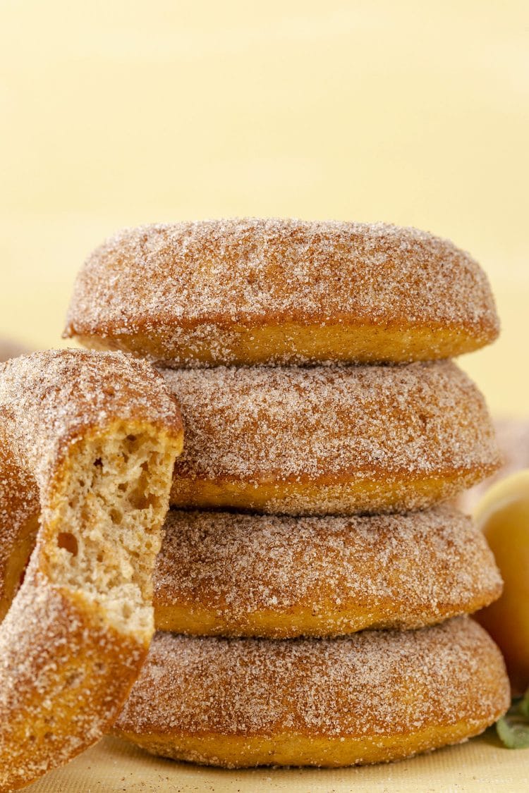 Close up of stack of apple cider donuts with cinnamon sugar