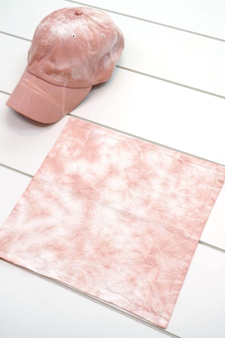 Blush pink avocado pit dyed cloth napkin and hat on white background