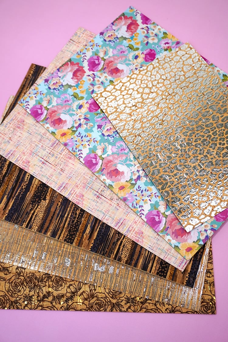 Sheets of patterned cork on purple background