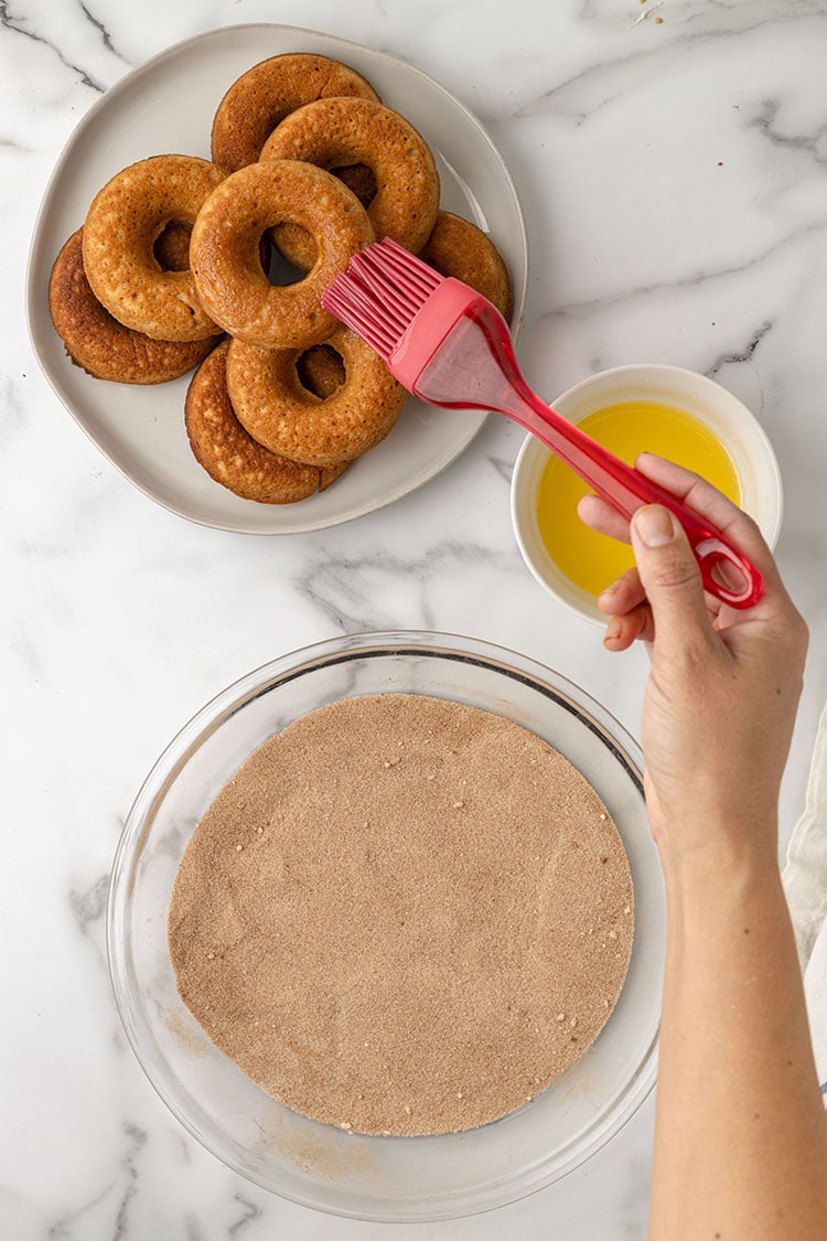 brushing the donuts with butter