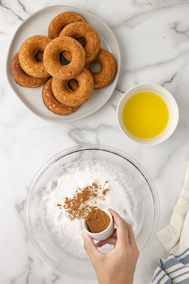 donut out of over, making the cinnamon sugar 