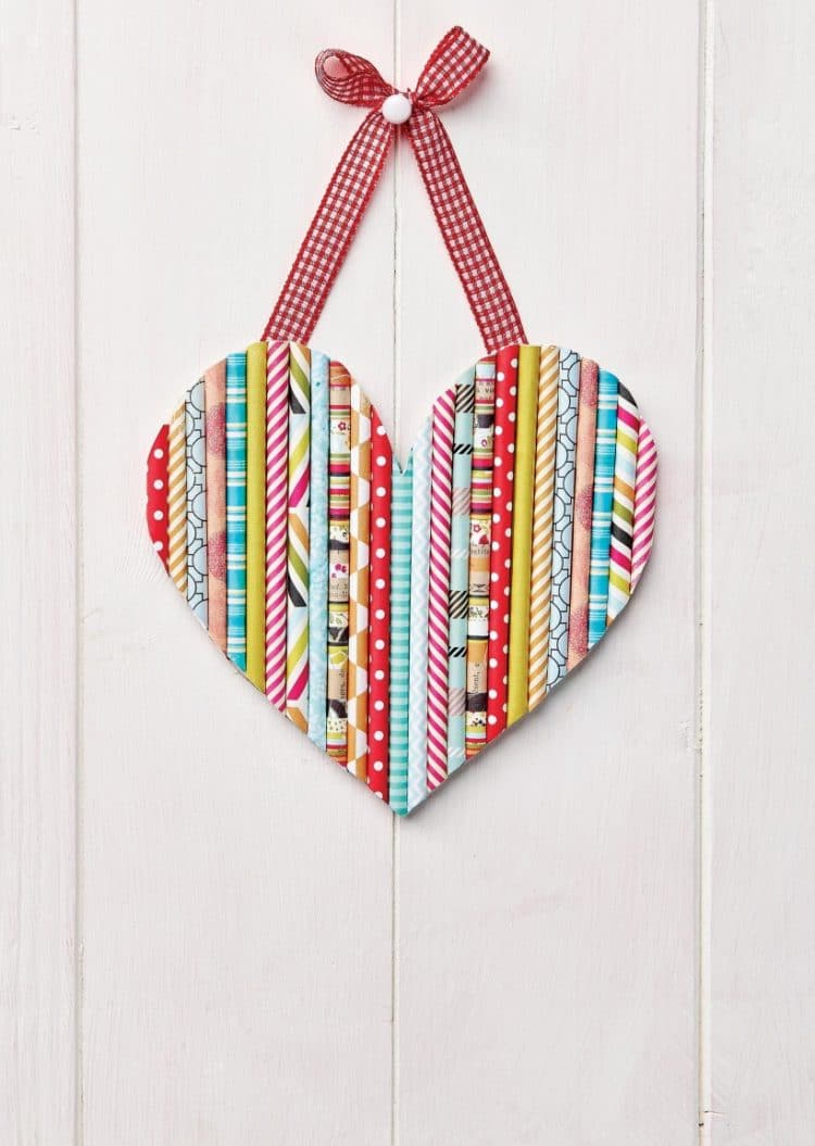 paper straws glued together to make heart and hung as door sign