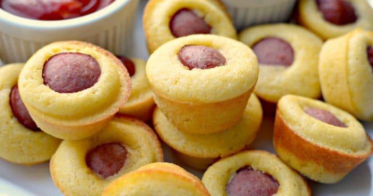 Stack of mini corndog bites - hot dog pieces in mini cornbread muffins 