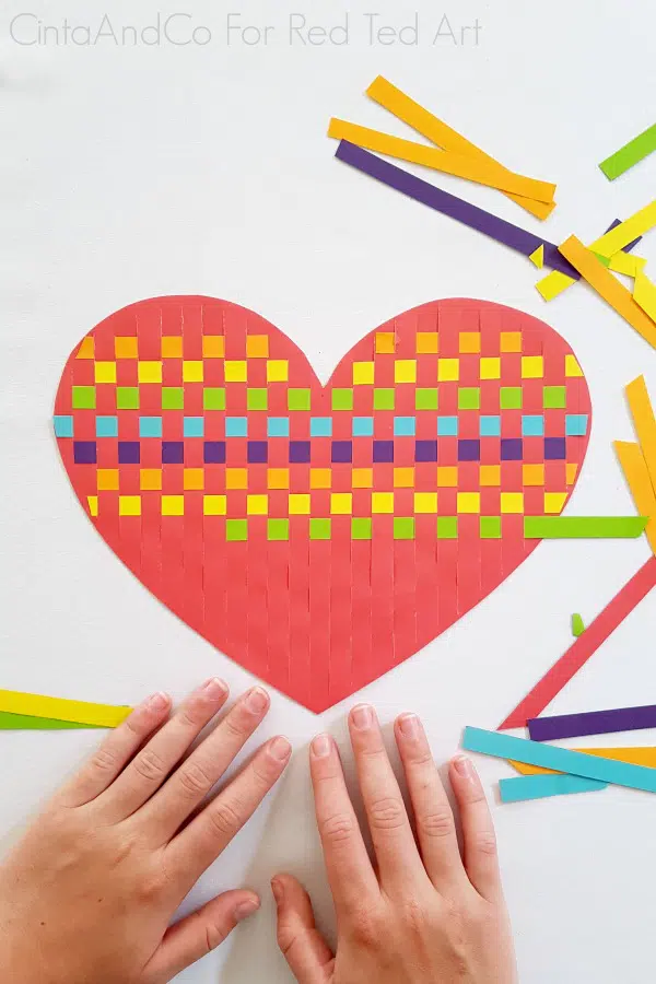 weaving a paper heart with cut paper strips