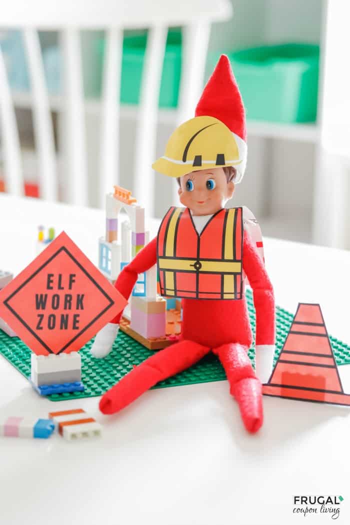 an elf is sitting on the table with construction signs