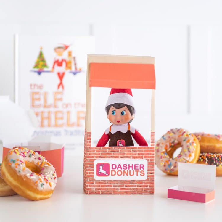 Elf on the shelf doll with donuts and donut shop window prop