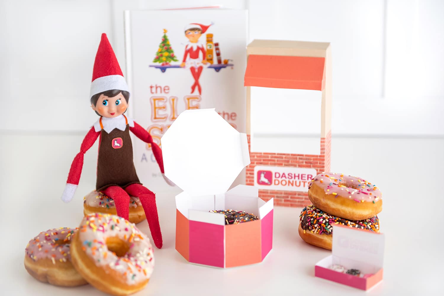 Elf on the Shelf with sprinkled donuts and printable donut shop props