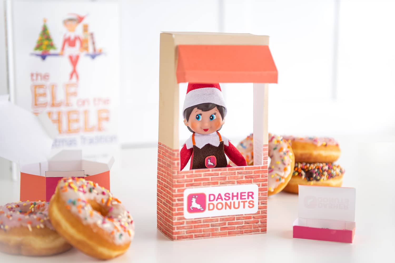Cute Elf on the Shelf Donut Shop props with donuts and book