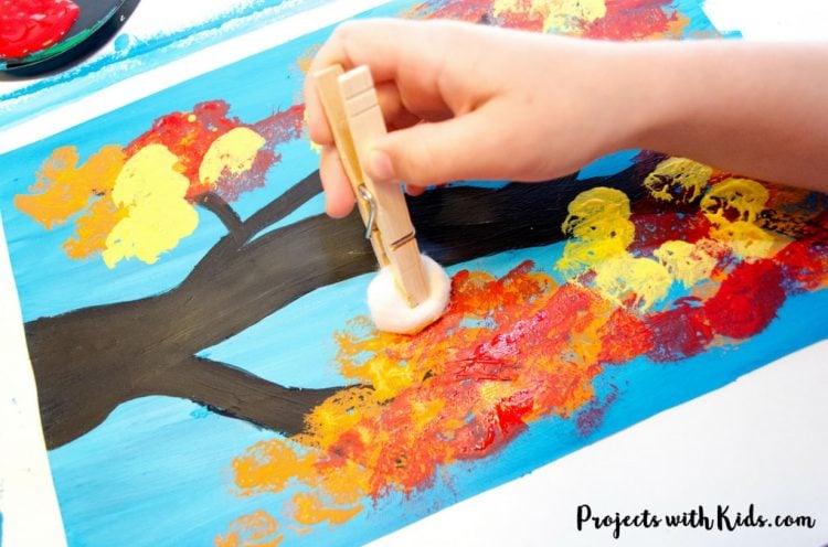 painting an autumn tree using a clothespin with cotton ball