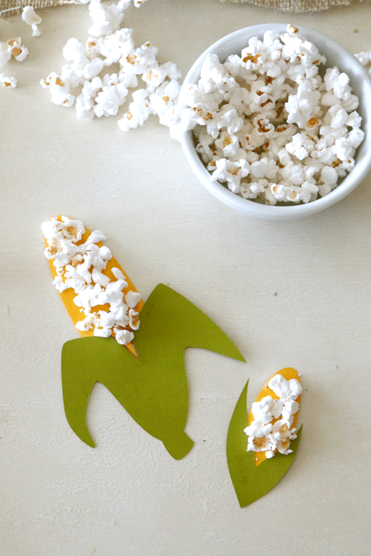 pop corn glued to corn with bowl of pop corn 