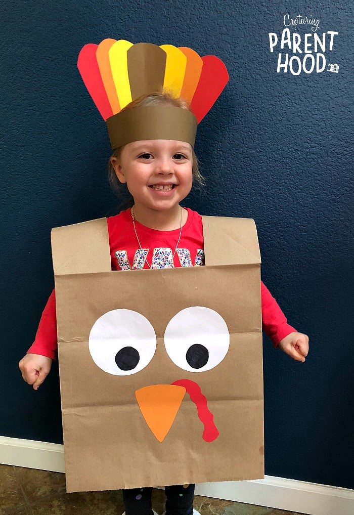 little kid wearing turkey costume for kids