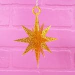3d star ornaments cut out from MDF wood painted with glitter