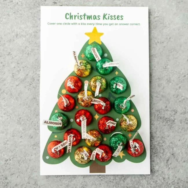 Christmas kisses trivia game card filled with hershey's kisses
