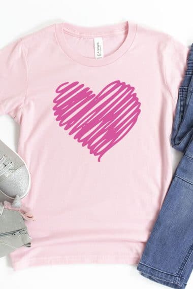 scribble heart svg file on pink shirt with jeans and shoes