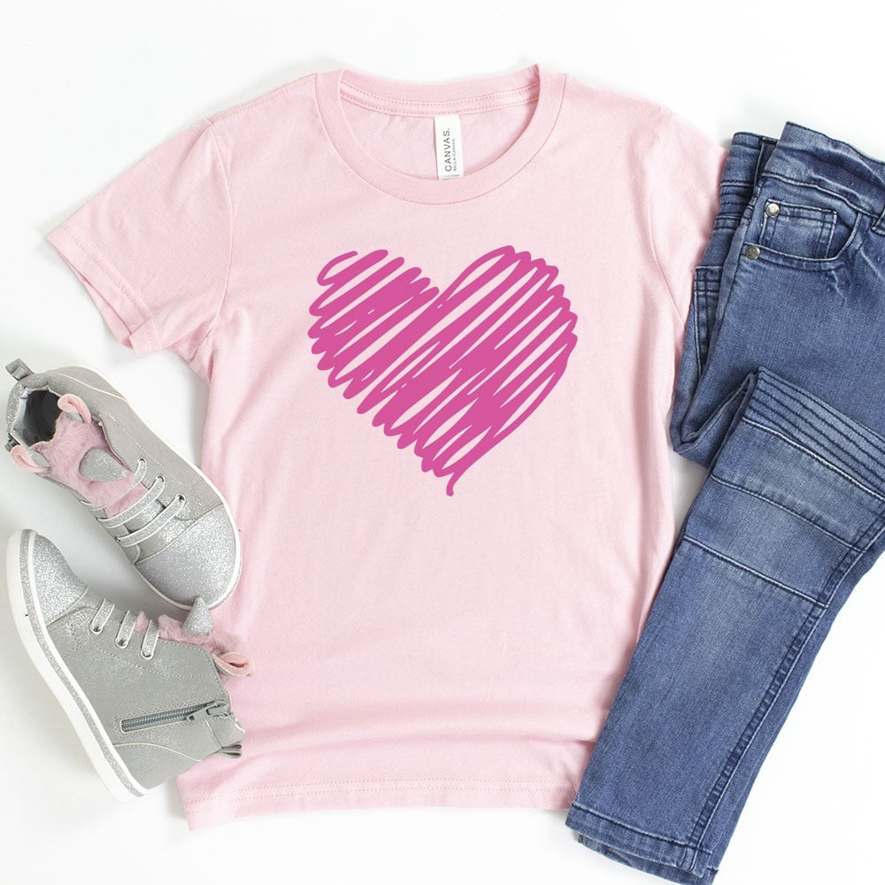 scribble heart svg file on pink shirt with jeans and shoes
