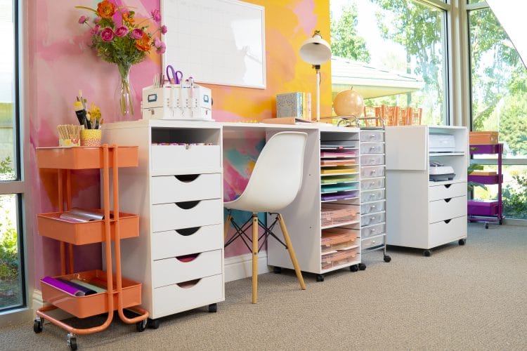 office desk space with craft materials in drawers organized