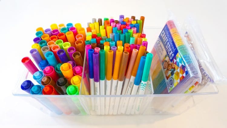 tub of markers in organizers