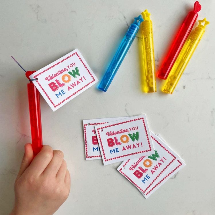 little hands gripping bubble wands and printable valentines cards